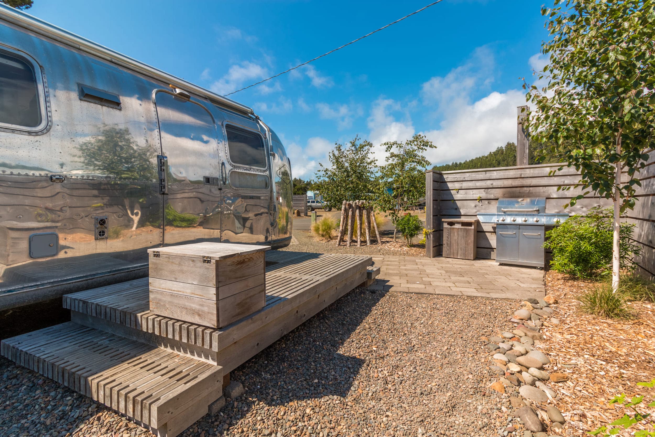 The BBQ area and deck area outside a bunk airstream at Harts Camp