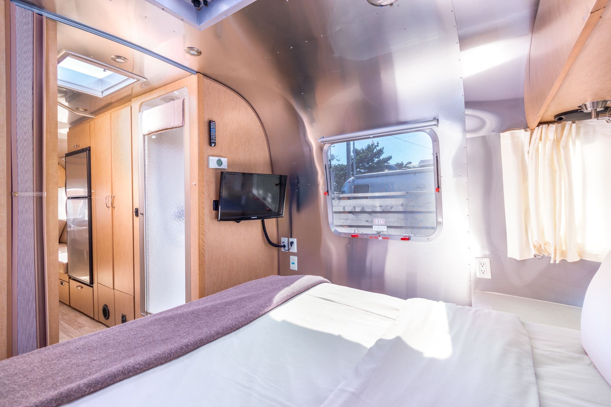 A view from the bed of a premium airstream at Harts Camp