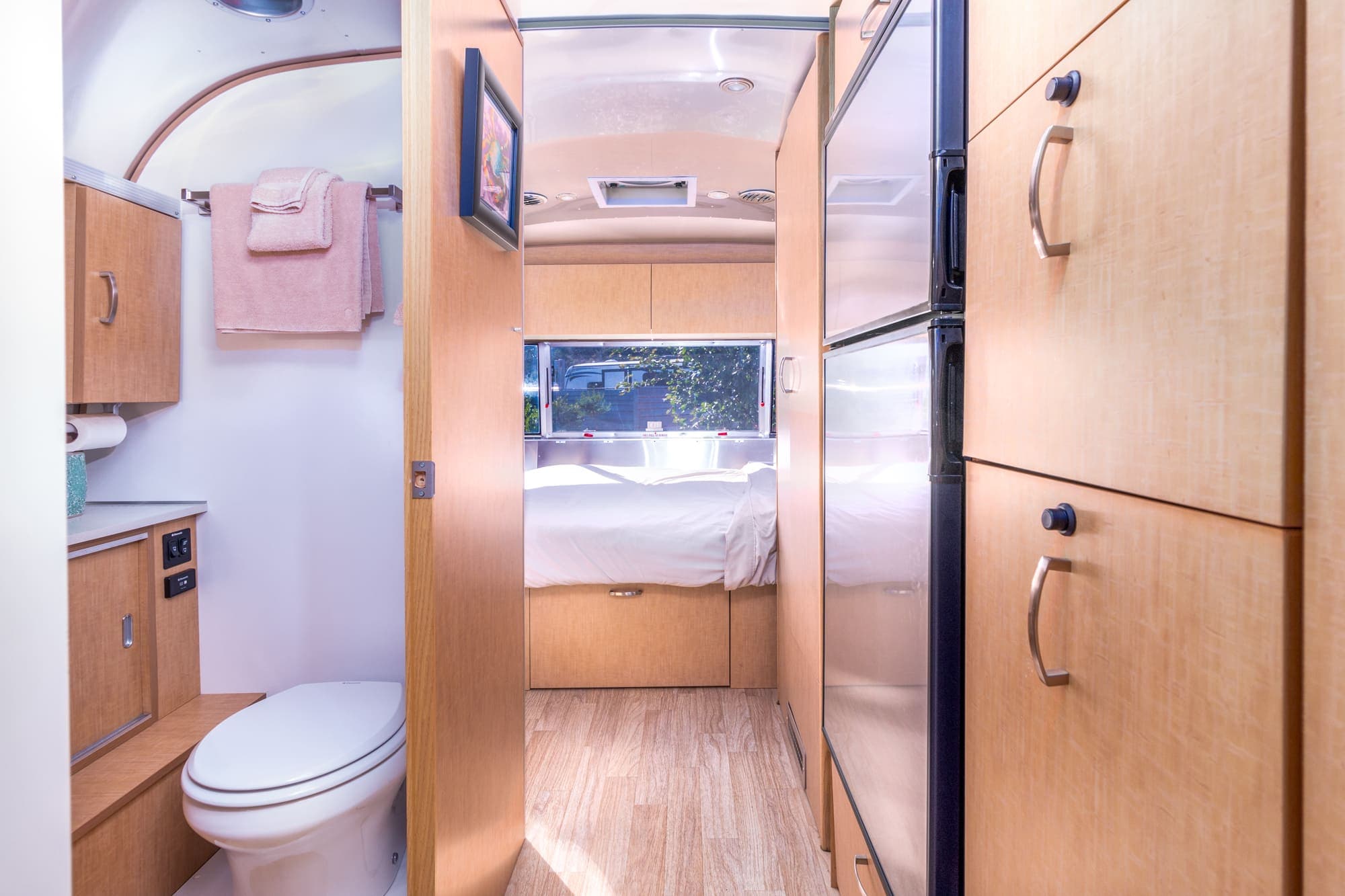 A view of the bedroom from the washroom of a standard airstream at Harts Camp