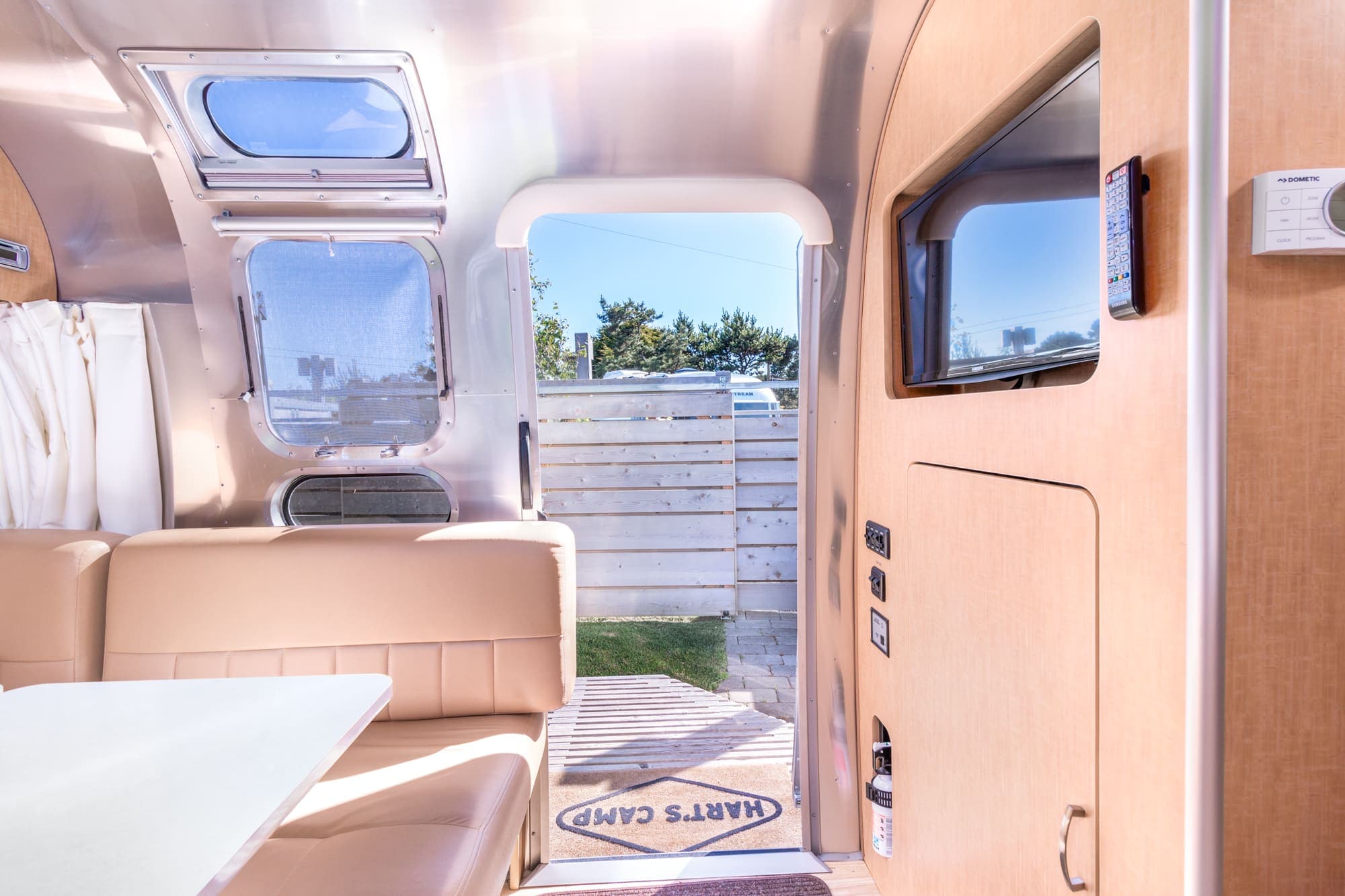 A table area beside the door leading outside of a standard airstream at Harts Camp