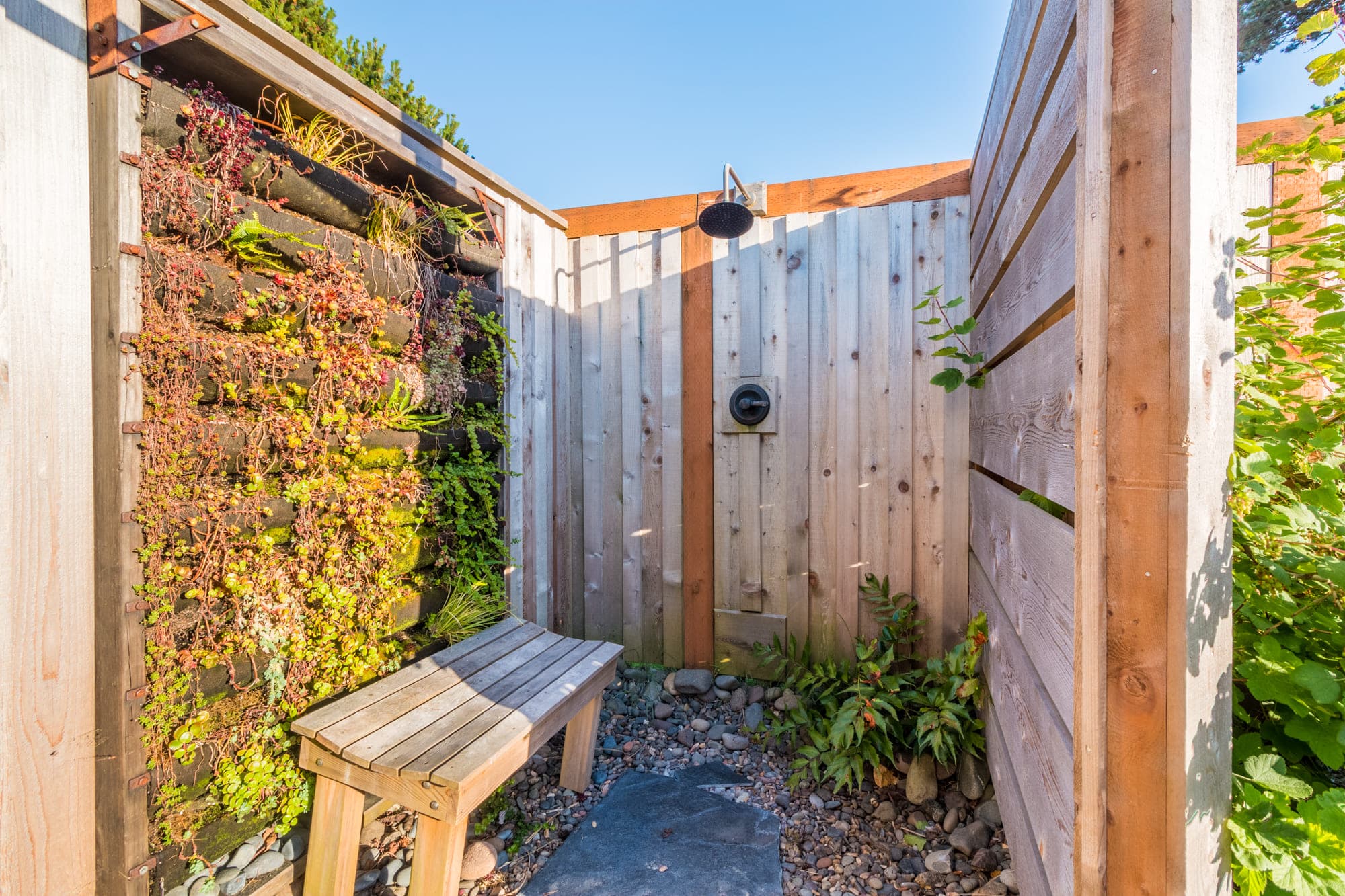 The outdoor shower area of a vintage airstream at Harts Camp