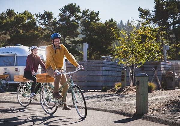 A couple riding bikes at Hart's Camp