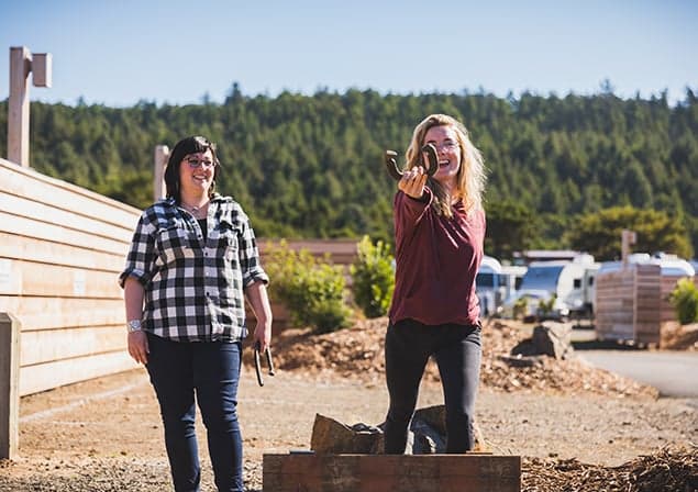 Two people playing horseshoes at Hart's Camp
