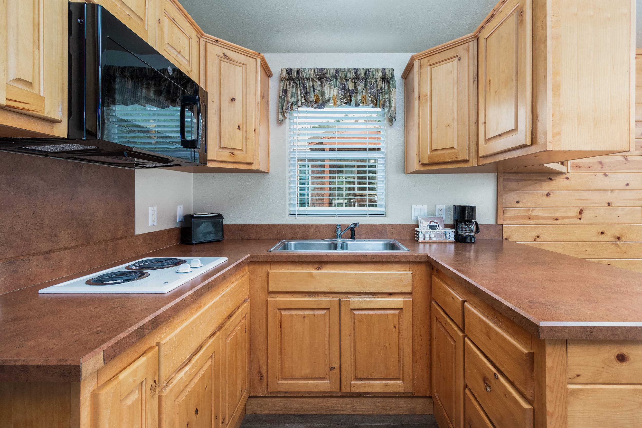 The kitchenette inside a cottage at Hart's Camp