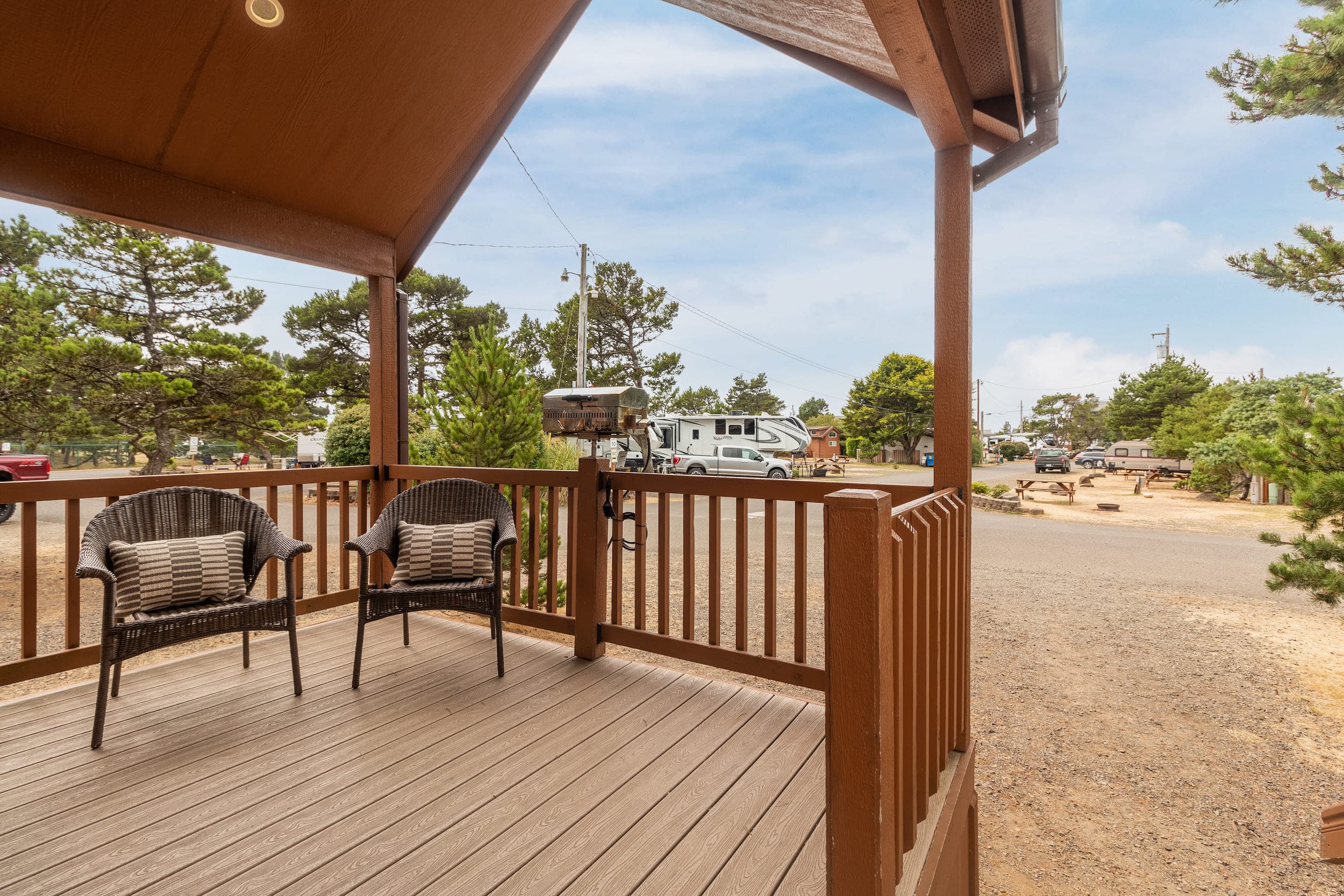 A porch with chairs at Hart's Camp, Pacific City, OR
