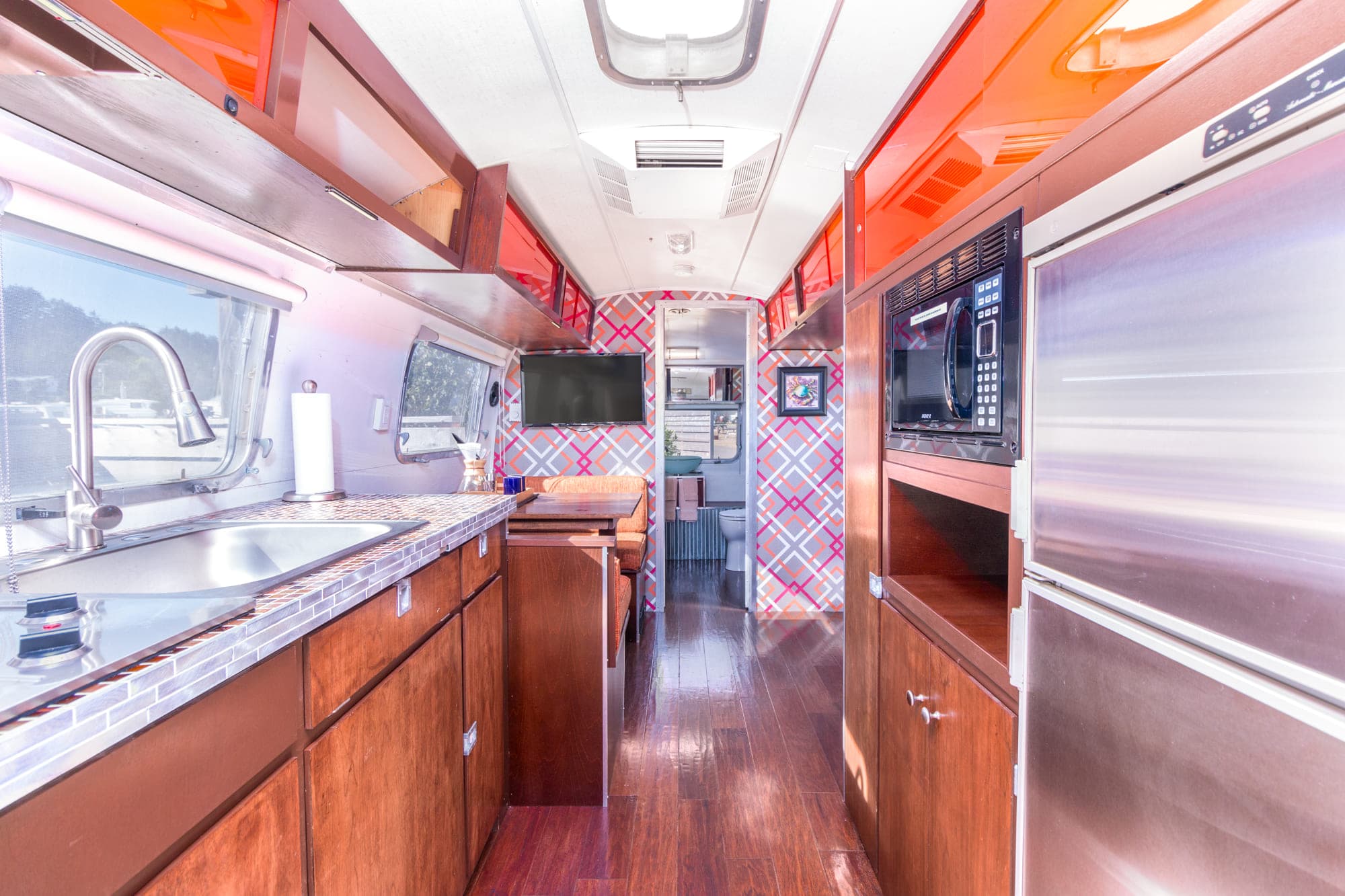The kitchen and dining area of a vintage airstream at Harts Camp
