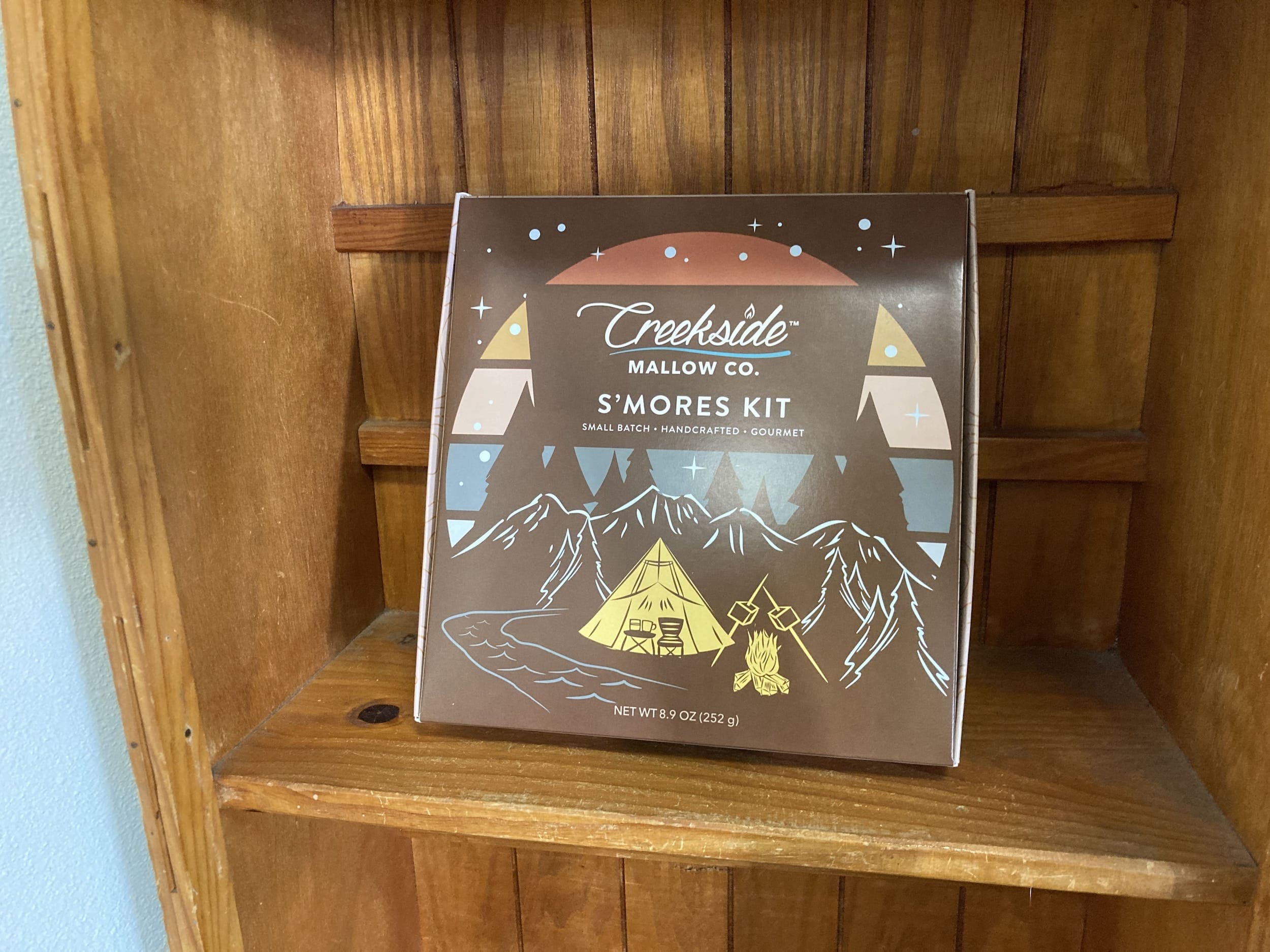 A S'mores kit sitting on a shelf in a cabin at Harts Camp