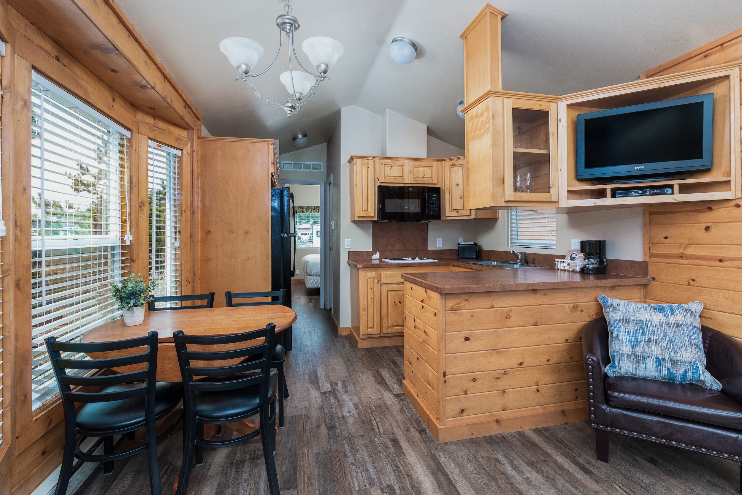 The dining area and kitchenette inside an accommodation at Hart's Camp, Pacific City, OR