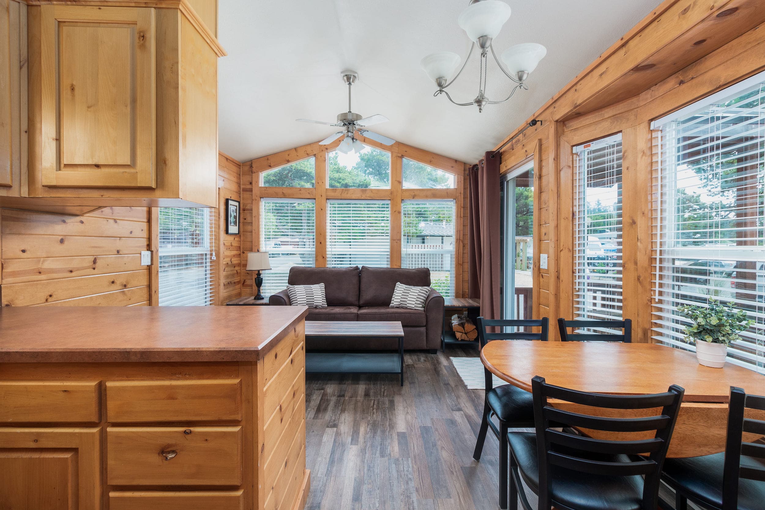 The living and dining areas inside a cottage at Hart's Camp