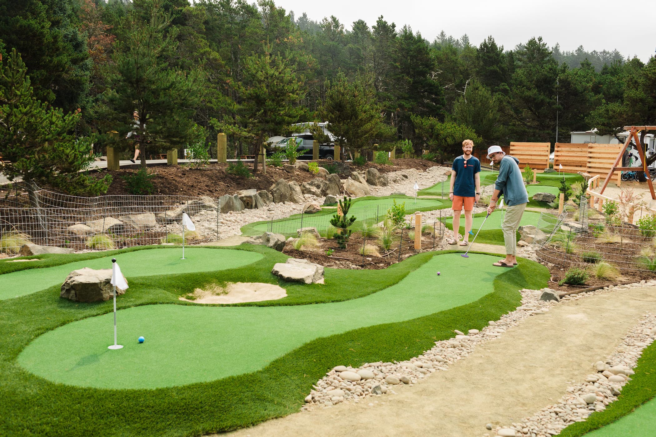 Two people mini putting at Cape Kiwanda
