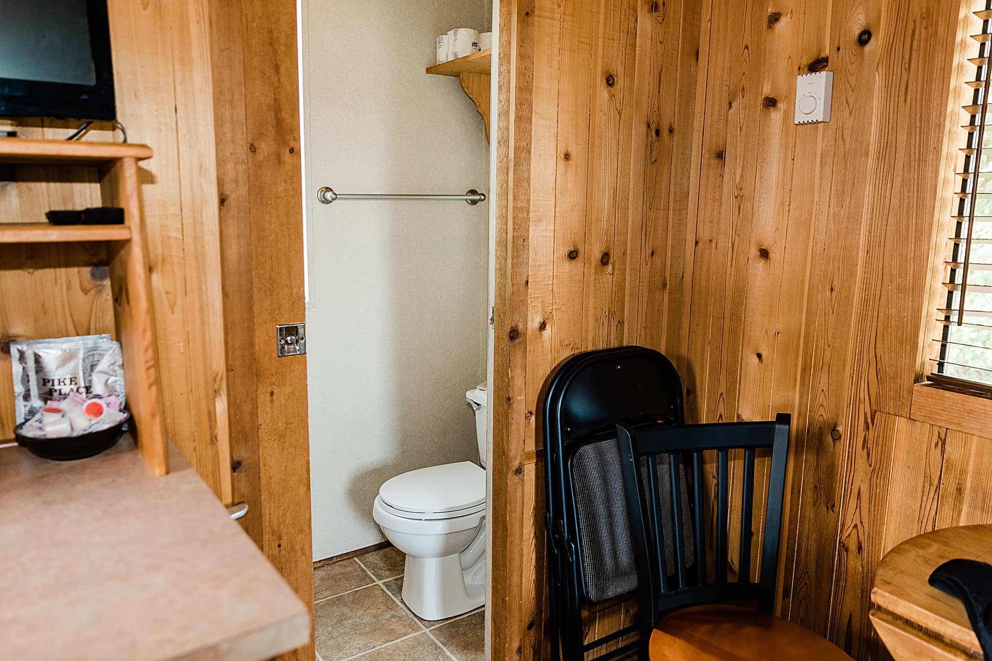 Private bathroom inside a deluxe cabin at The Inn at Hart's Camp, Pacific City, Oregon