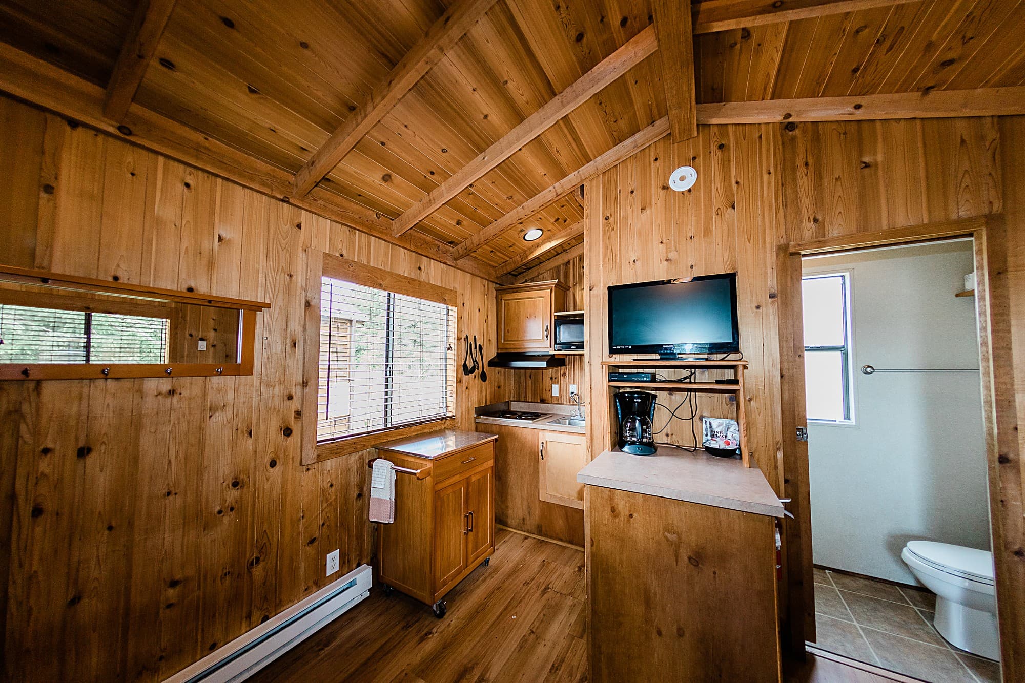 Deluxe cabin kitchenette and private bathroom at the pet-friendly Hart's Camp resort near Cape Kiwanda, Oregon