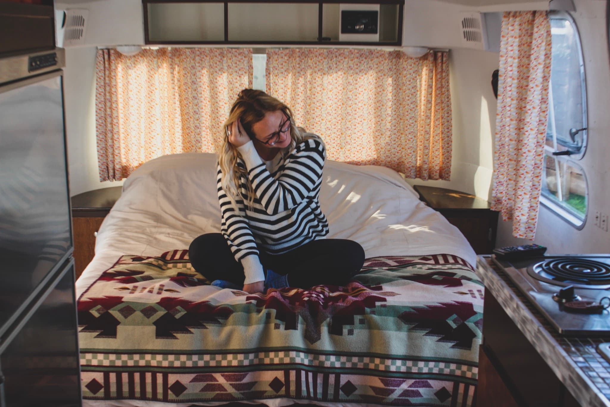 woman sitting on rv bed