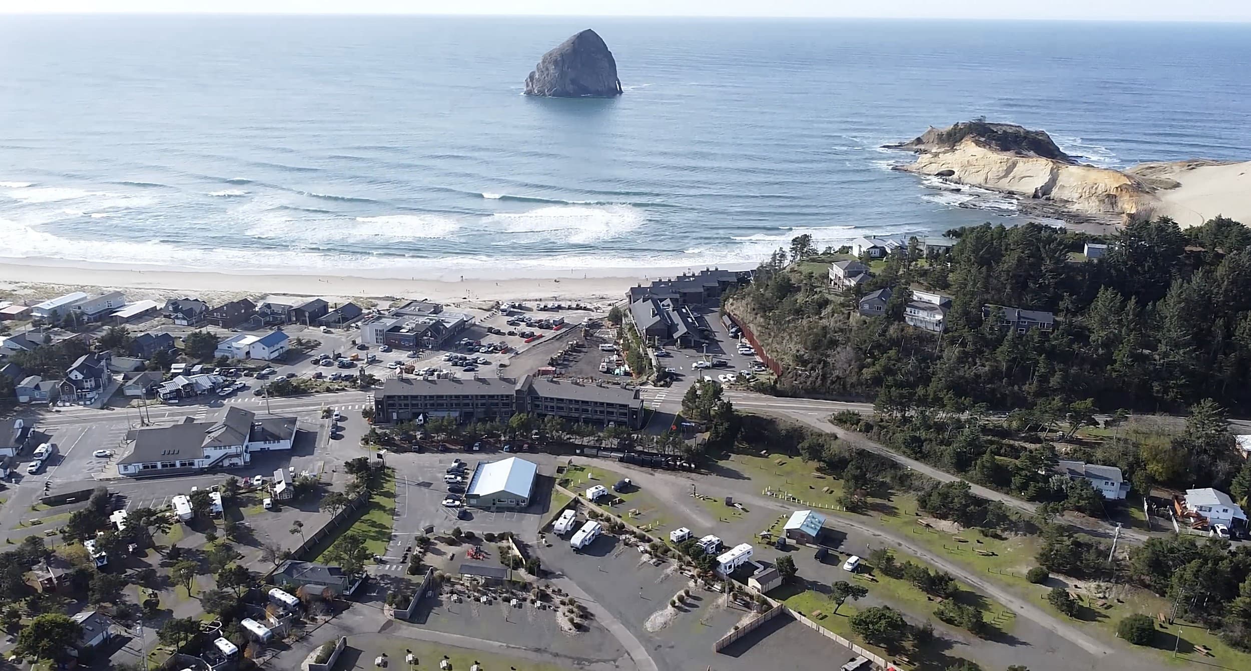 Aerial view of The Inn at Hart's Camp Airstream park in Pacific City, Oregon, with Cape Kiwanda and Haystack Rock along the Oregon Coast